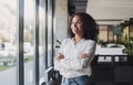 Young businesswoman portrait, Self confident young woman with crossed arms at office, People candid portraits