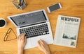 Young businesswoman reading news on laptop screen in office Royalty Free Stock Photo