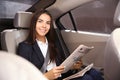 Young businesswoman reading newspaper in car Royalty Free Stock Photo
