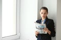 Young businesswoman reading newspaper in office Royalty Free Stock Photo