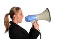Young businesswoman screaming with a megaphone