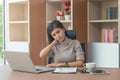 Young businesswoman or secretary working with laptop and have a neck and shoulder pain after work hard in office feeling so pain Royalty Free Stock Photo