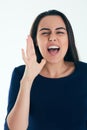 Young businesswoman shouting isolated on white background. Advertising, annonce, message, event.