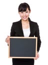 Young Businesswoman showing blank of chalkboard Royalty Free Stock Photo