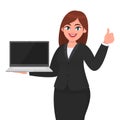 Young businesswoman showing a new brand laptop and making thumb up gesture sign. Person holding portable computer.