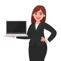 Young businesswoman showing new laptop . Person holding wireless digital computer. Female character design illustration. Royalty Free Stock Photo