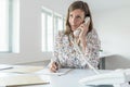 Young businesswoman talking on a phone