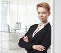 Young businesswoman standing arms crossed Royalty Free Stock Photo