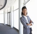 Young Businesswoman Standing In Corridor Of Modern Office Building Royalty Free Stock Photo