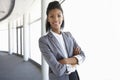 Young Businesswoman Standing In Corridor Of Modern Office Building Royalty Free Stock Photo