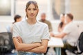 She woke up and chose success. a young businesswoman standing with her arms crossed in the boardroom with her colleagues Royalty Free Stock Photo