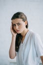 young businesswoman suffering from headache and looking Royalty Free Stock Photo