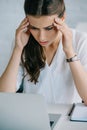 young businesswoman suffering from headache while working Royalty Free Stock Photo