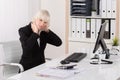 Businesswoman Suffering From Neckache In Office Royalty Free Stock Photo