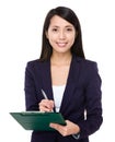 Young businesswoman take note on clipboard Royalty Free Stock Photo