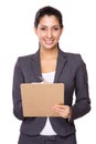Young businesswoman take note on clipboard Royalty Free Stock Photo