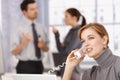 Young businesswoman talking on phone in office Royalty Free Stock Photo