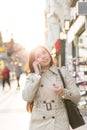 Young businesswoman talking on phone outdoor