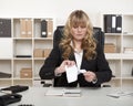 Young businesswoman tearing up a document Royalty Free Stock Photo