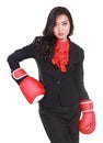 Young businesswoman using boxing gloves