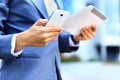 Young businesswoman using digital tablet and mobile phone