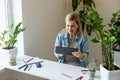 Young businesswoman using digital tablet in her office Royalty Free Stock Photo