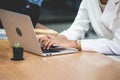 Young businesswoman using laptop computer