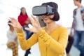 Young businesswoman using virtual reality headset in a modern office Royalty Free Stock Photo