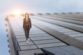 Young businesswoman walking towards success Royalty Free Stock Photo