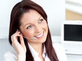 Young businesswoman wearing earpiece in her office Royalty Free Stock Photo