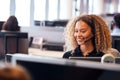 Young Businesswoman Wearing Telephone Headset Talking To Caller In Customer Services Department Royalty Free Stock Photo