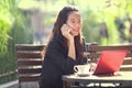 Young businesswoman work oudoor, in a cafe Royalty Free Stock Photo