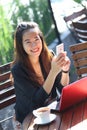 Young businesswoman work oudoor, in a cafe Royalty Free Stock Photo