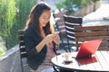 Young businesswoman work oudoor, in a cafe Royalty Free Stock Photo