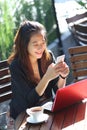 Young businesswoman work oudoor, in a cafe Royalty Free Stock Photo