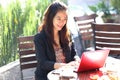 Young businesswoman work oudoor, in a cafe Royalty Free Stock Photo