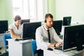 Young businesswoman working in a call center with his colleagues Royalty Free Stock Photo