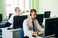 Young businesswoman working in a call center with his colleagues Royalty Free Stock Photo