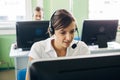 Young businesswoman working in a call center with his colleagues Royalty Free Stock Photo