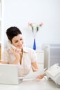 Young businesswoman working at home