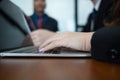 Young businesswoman working with mobile laptop and documents in office, business concept