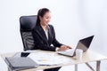 Young businesswoman working in office, typing, using computer. Royalty Free Stock Photo