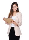 Young businesswoman write on clipboard