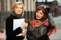 Young businesswomen with a folder Royalty Free Stock Photo