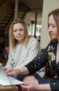 Young businesswomen having conversation at informal meeting Royalty Free Stock Photo