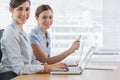 Young businesswomen working on their laptops portrait Royalty Free Stock Photo