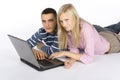 Young busy couple with laptop
