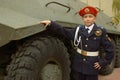 Young cadet with an armored troop carrier Royalty Free Stock Photo