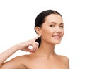 Young calm woman pointing to her ear Royalty Free Stock Photo