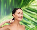 Young calm woman pointing to her ear Royalty Free Stock Photo